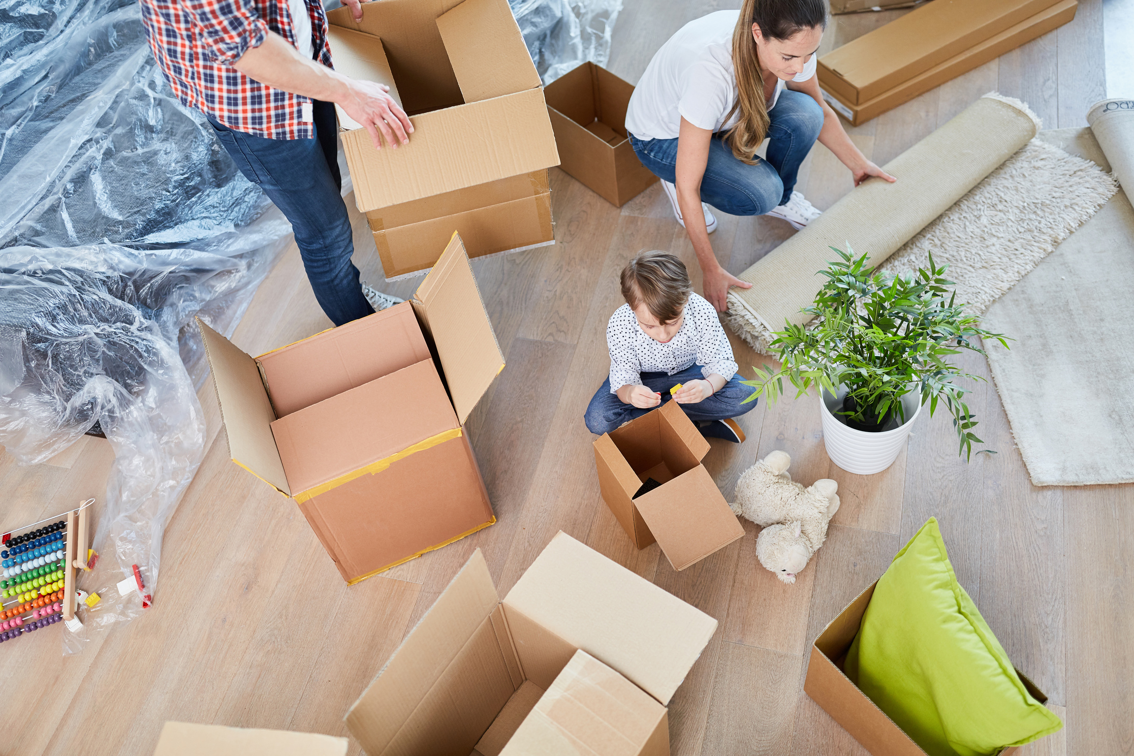 Family Unpacks Moving Boxes